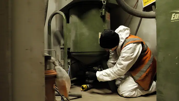 Engineer fixing blast pot