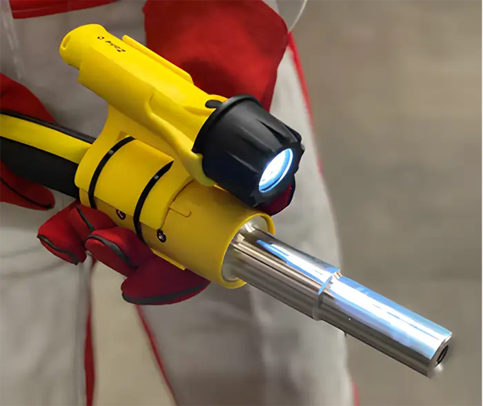 Blaster pointing a blast nozzle